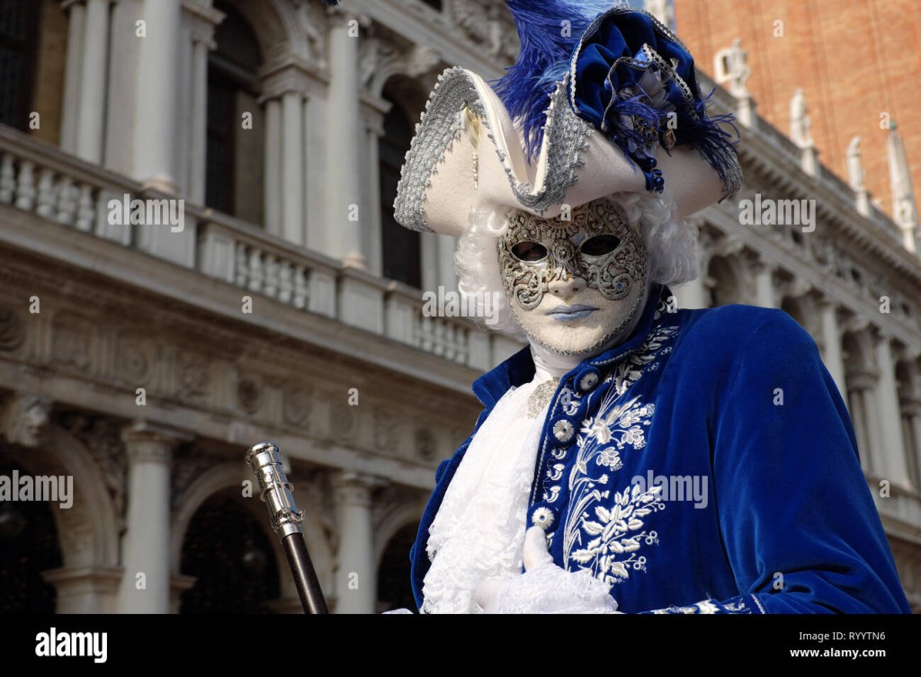 Picture of: Man dressed in traditional mask and costume for Venice Carnival